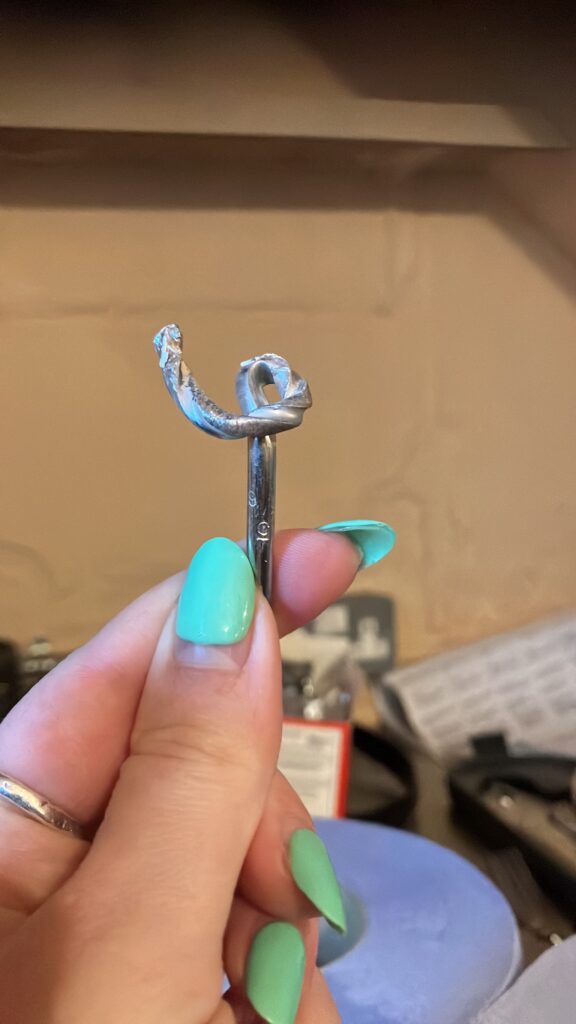 A severely bent out of shape drill bit
